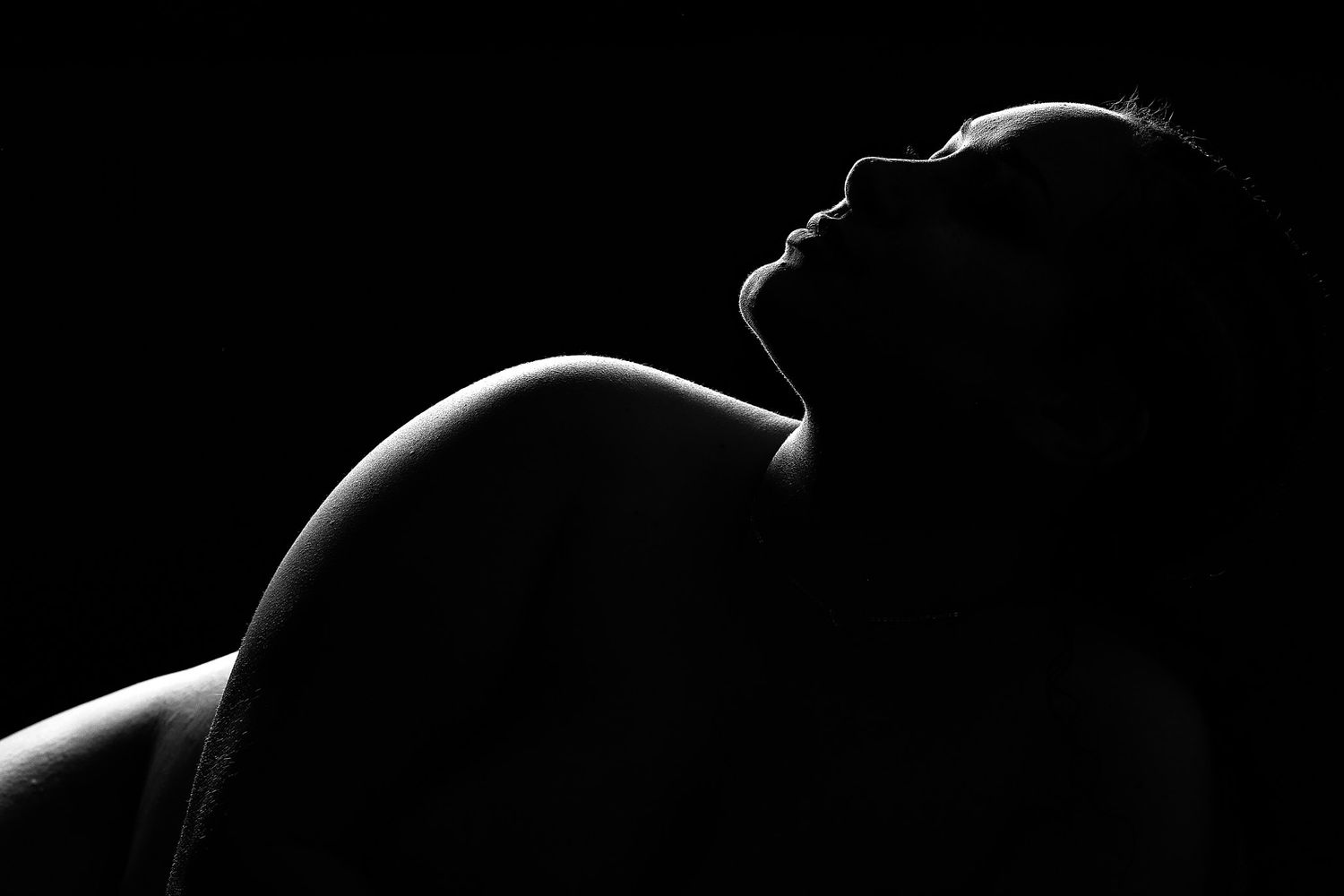 High-end boudoir photography featuring expert-guided posing and dramatic studio lighting by a Charlotte NC boudoir photographer.