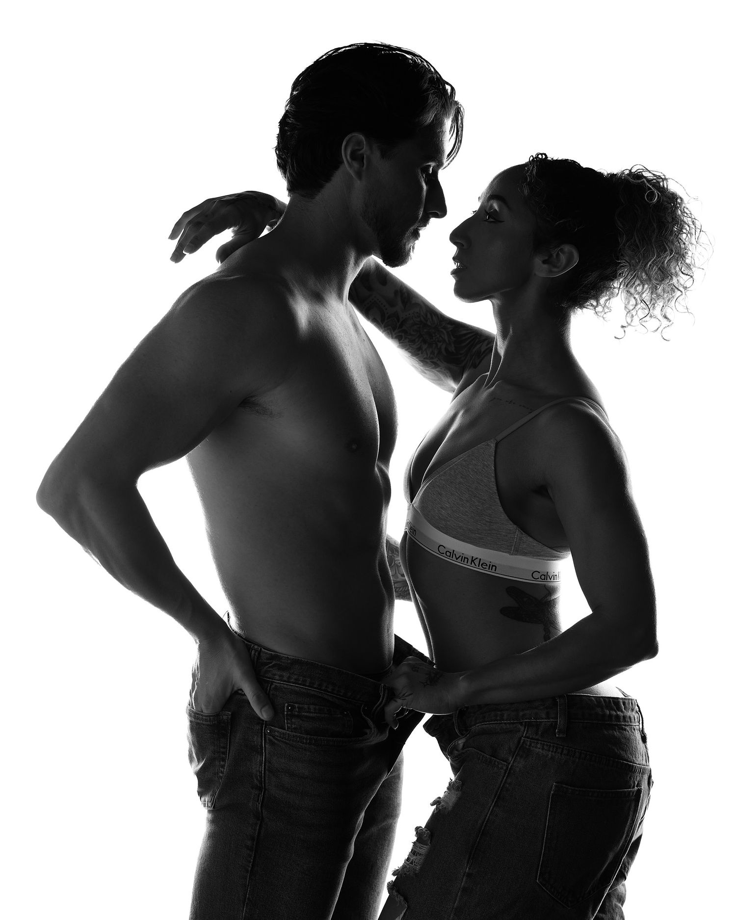 High-end Charlotte couples boudoir photography with professional posing and cinematic studio lighting.
