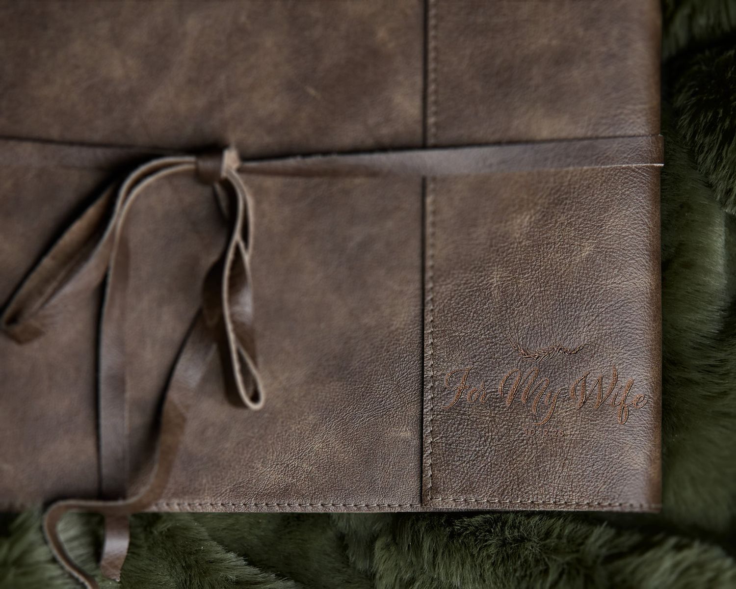 Hand-stitched leather journal-style boudoir album with fine art paper, a premium heirloom product for luxury photography sessions.