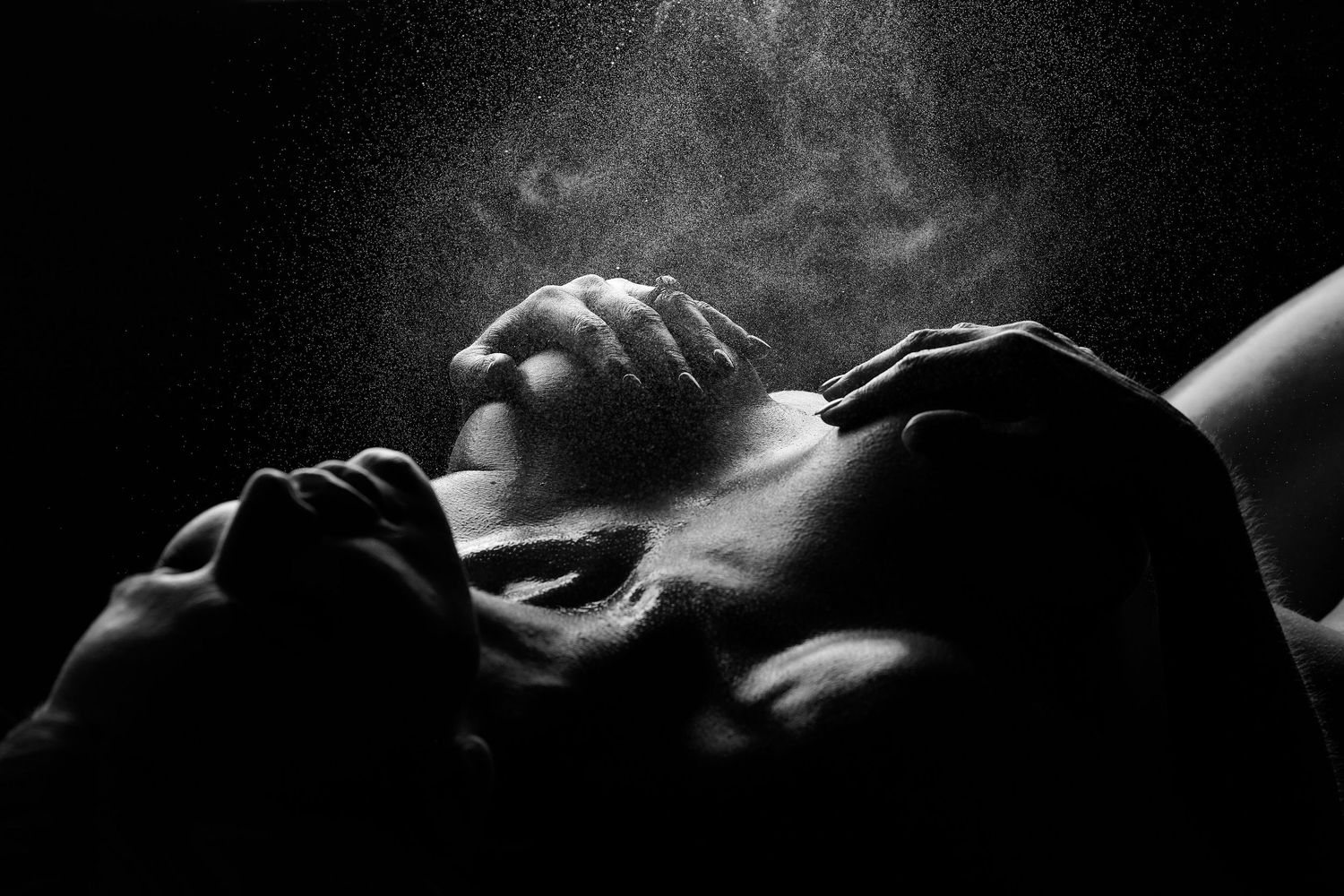 Dramatic close-up bodyscape boudoir photo highlighting delicate shadows and natural curves by a Charlotte NC boudoir photographer.