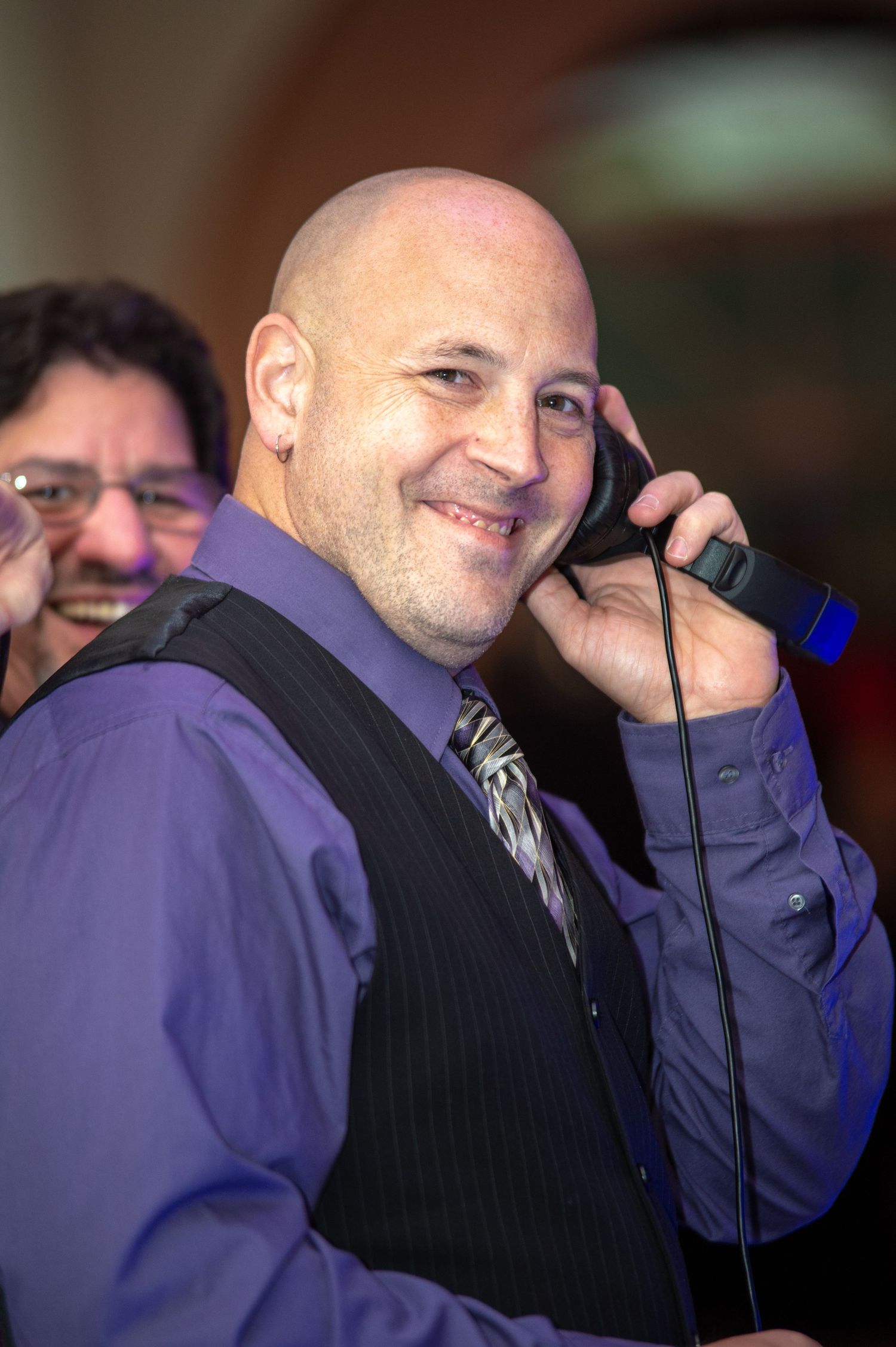 Wedding guests sharing laughter and conversation during the reception celebration.