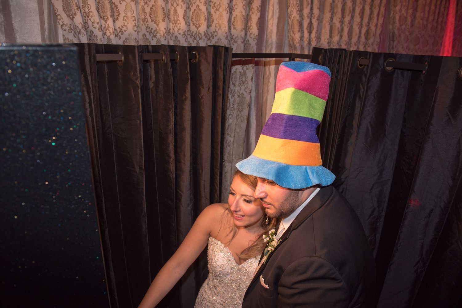 Wedding reception dance floor with colorful party hats and festive celebration atmosphere.