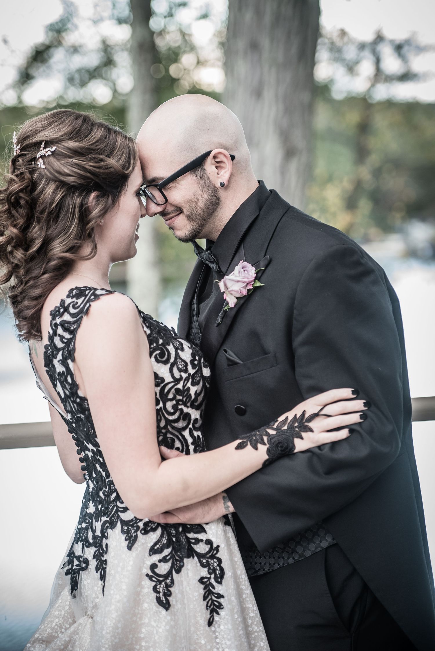 Winter wedding portraits featuring elegant black lace details against snowy background.