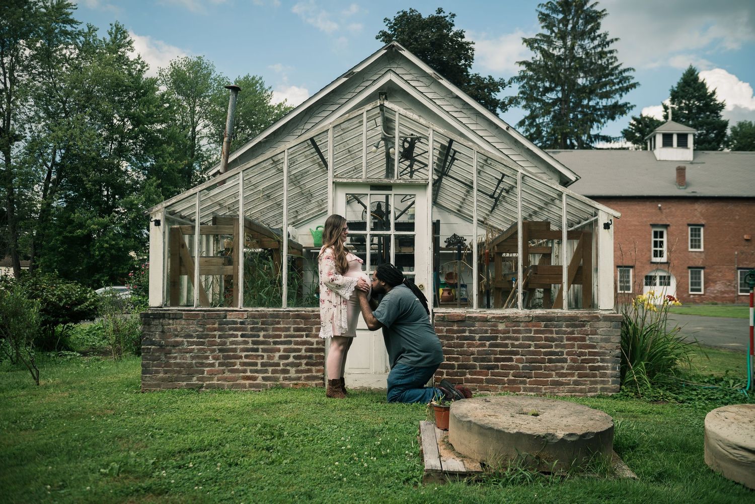 Wedding venue exterior featuring classic architecture and greenhouse-style windows.