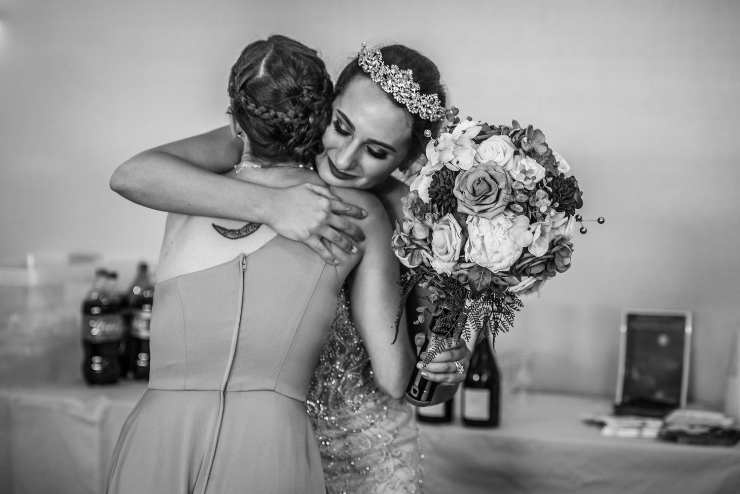 A romantic wedding photoshoot sequence showing tender moments between newlyweds in black and white.