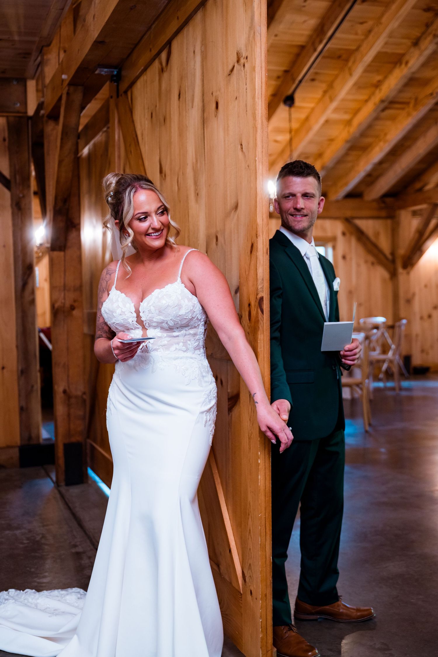 Wedding celebration moments inside a rustic wooden barn venue.