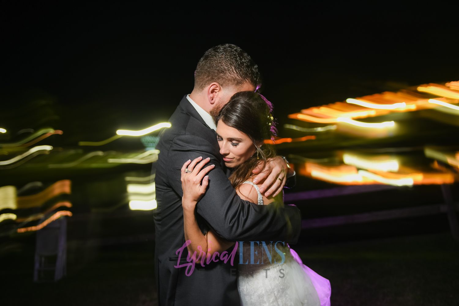 Artistic nighttime wedding photography with creative light effects.