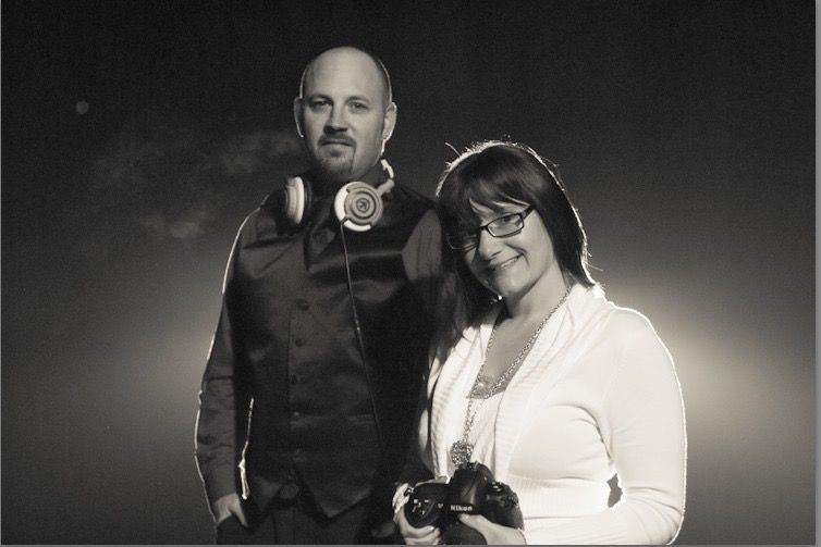 Professional photography studio setup with dramatic black and white lighting.