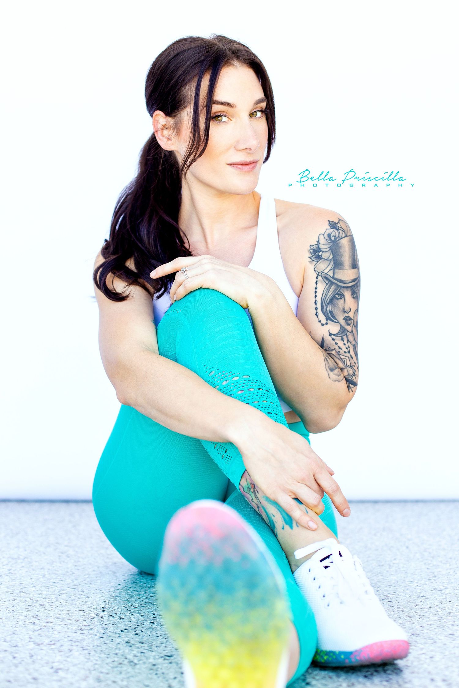 Branding photography for a female Personal Trainer against a white backdrop in natural light New Braunfels Texas.