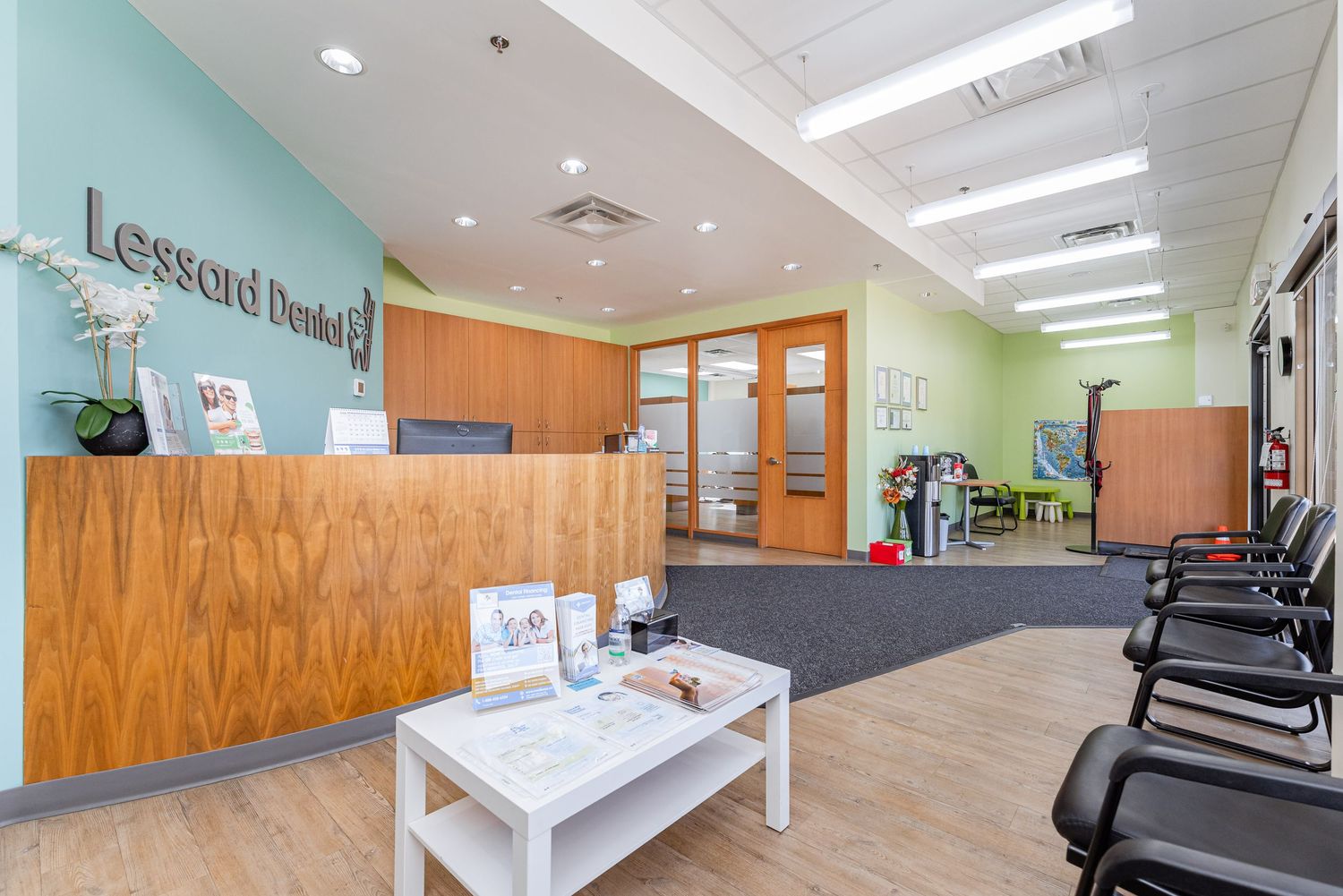 Modern dental office interior with clean white walls and wood accents.