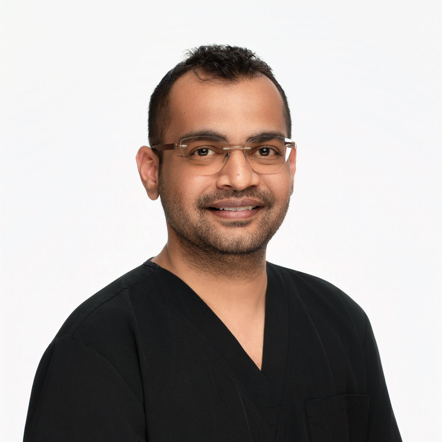 Professional headshot of person in black v-neck top against white background.