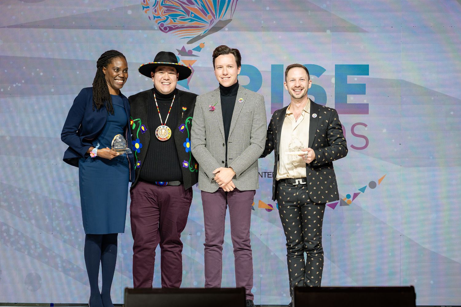Professional presenters on stage at the RISE conference.