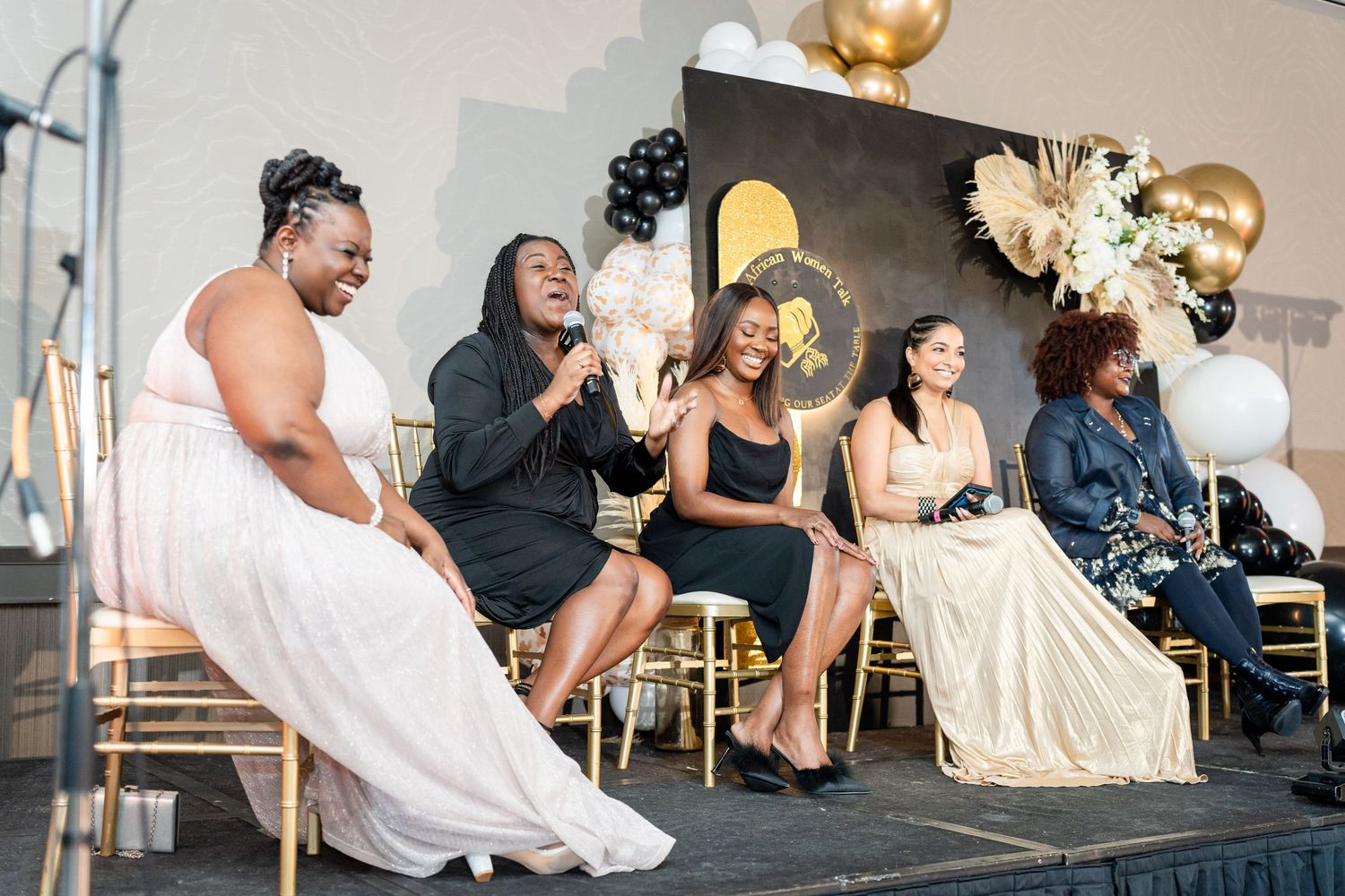 Event guests in formal wear seated at tables during an elegant celebration.