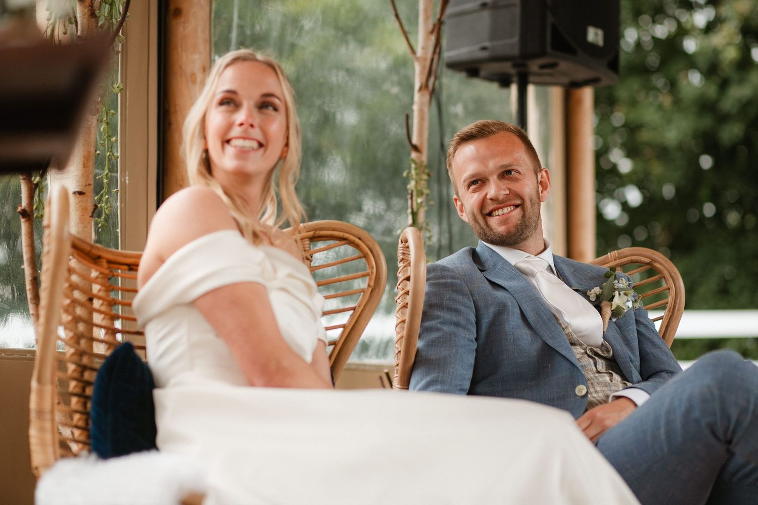 Wedding ceremony venue decorated with elegant floral arrangements and natural light.