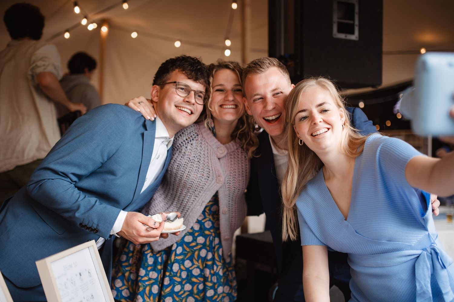 Candid moments of wedding guests laughing and celebrating during indoor reception.