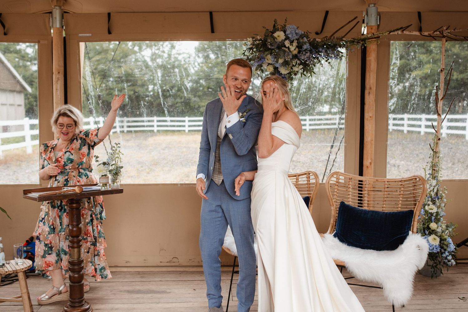 Couple shares an intimate dance moment at their rustic outdoor wedding reception.