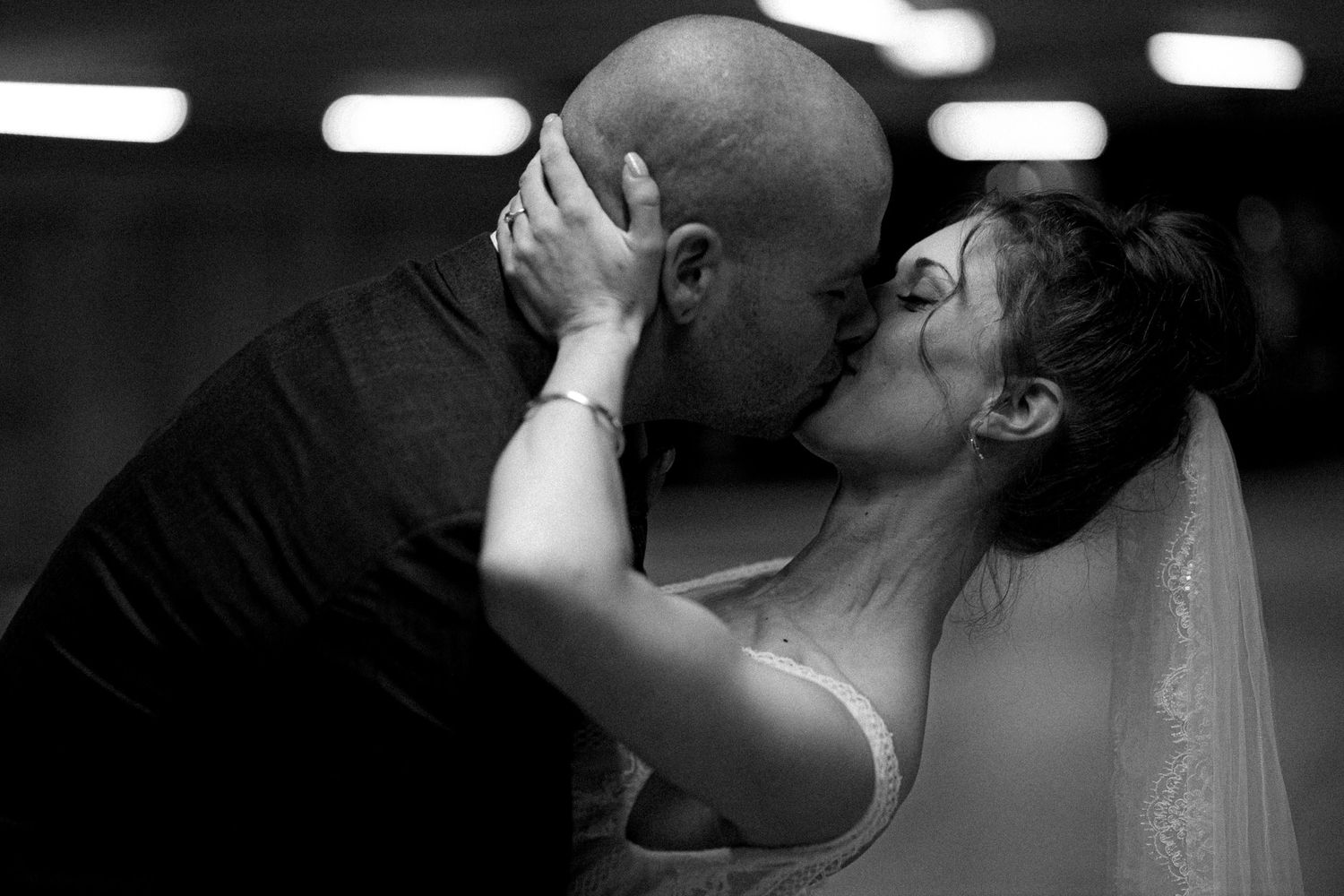 Black and white wedding portraits showing tender moments between newlyweds.