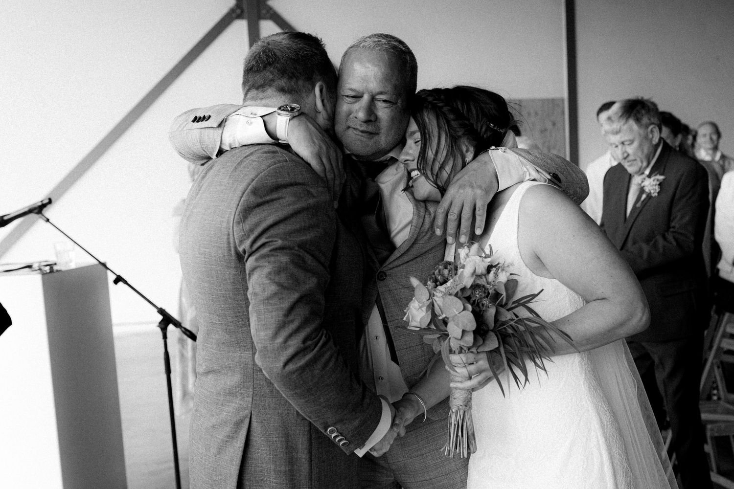 A series of emotional black and white wedding moments captured in candid photographs.