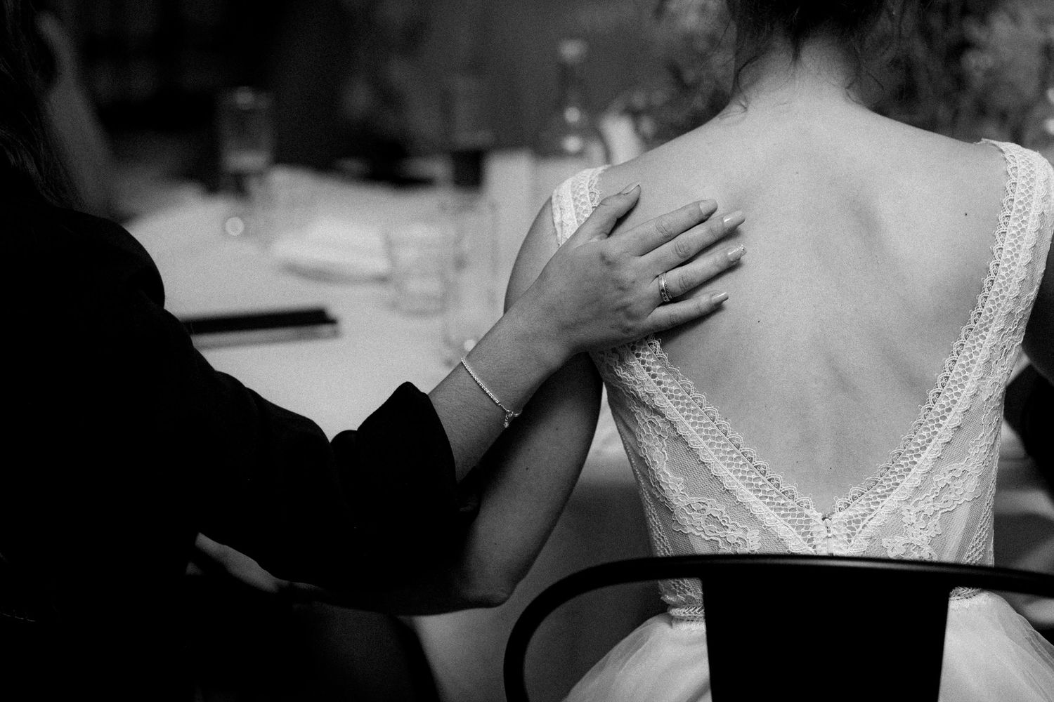 Close-up details of formal wedding attire and embraces during celebrations.