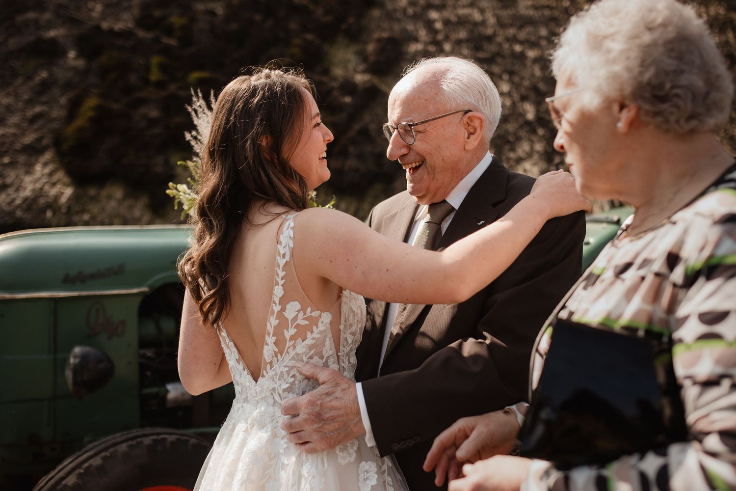 Tender moments shared during an outdoor wedding celebration.