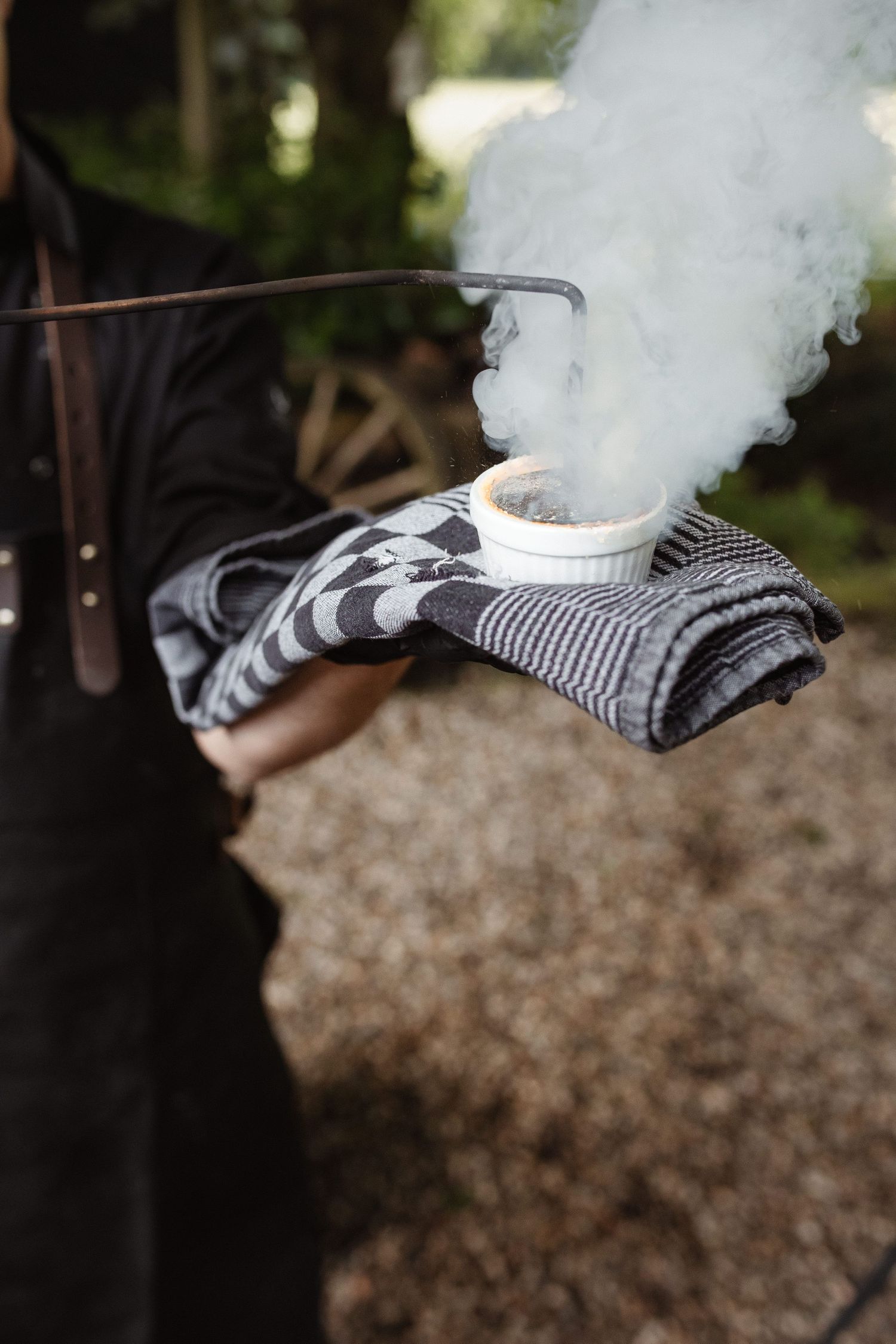 Smoke effect creating atmospheric ambiance against dark background at wedding event.