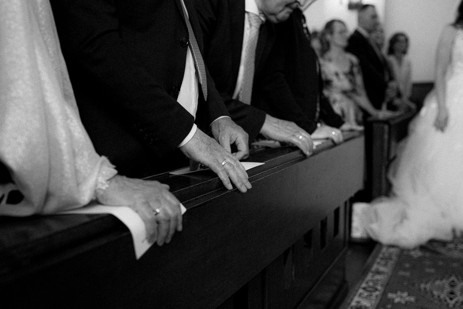 Guests celebrate during an intimate church wedding ceremony.