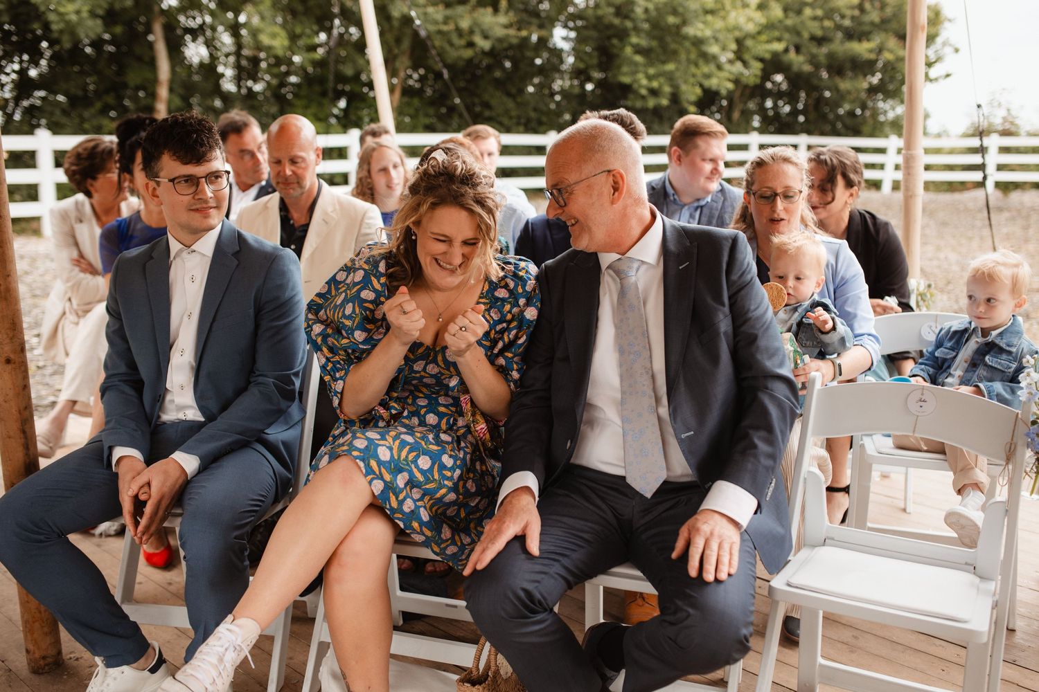 Wedding guests enjoying refreshments at an outdoor reception.