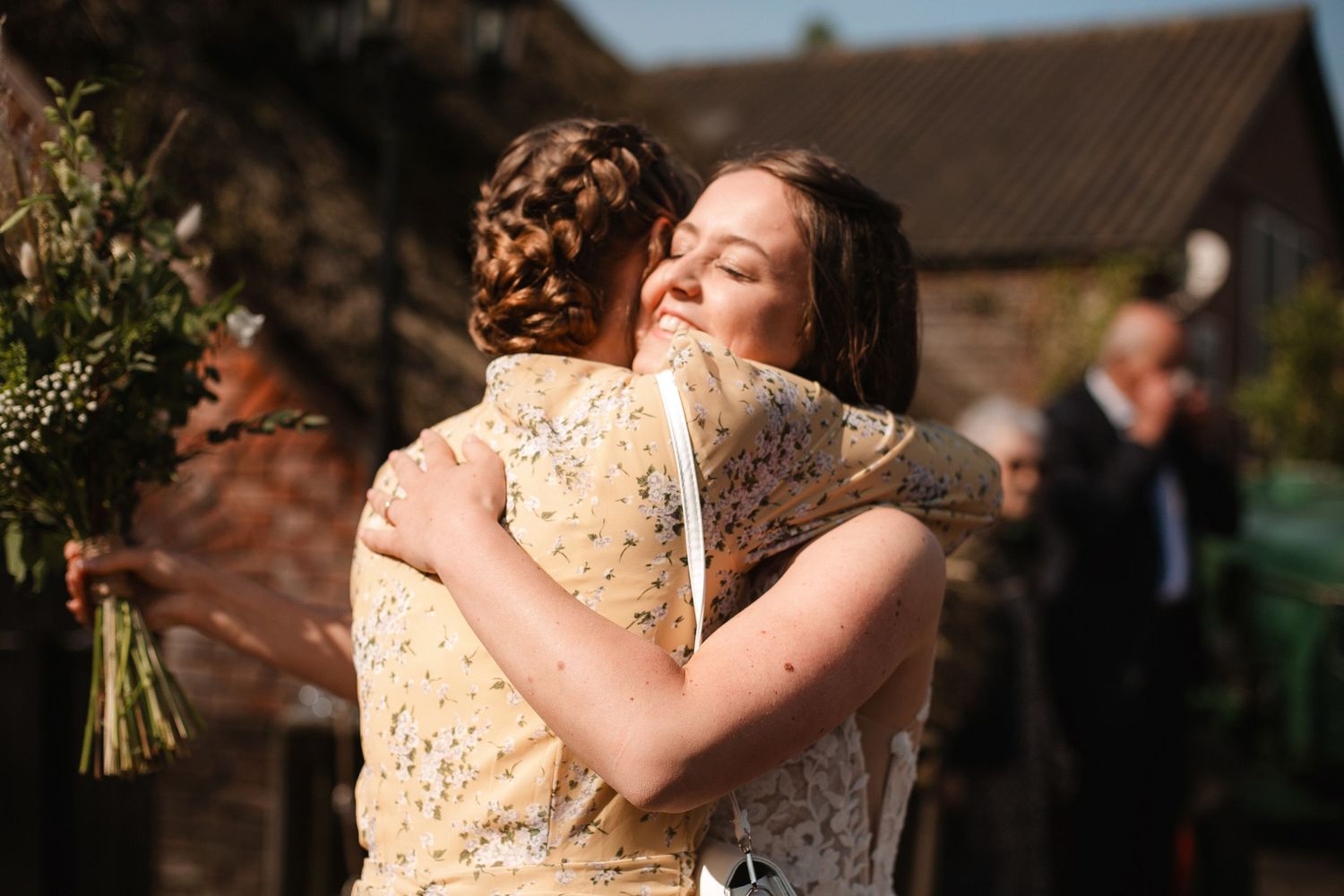 Emotional embraces shared during a wedding celebration.