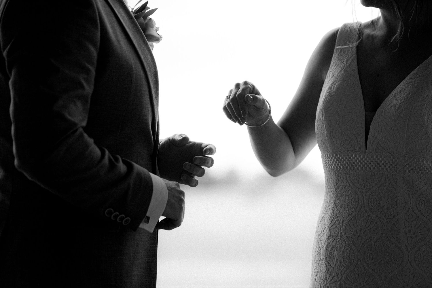 Artistic black and white silhouettes capturing intimate wedding moments.