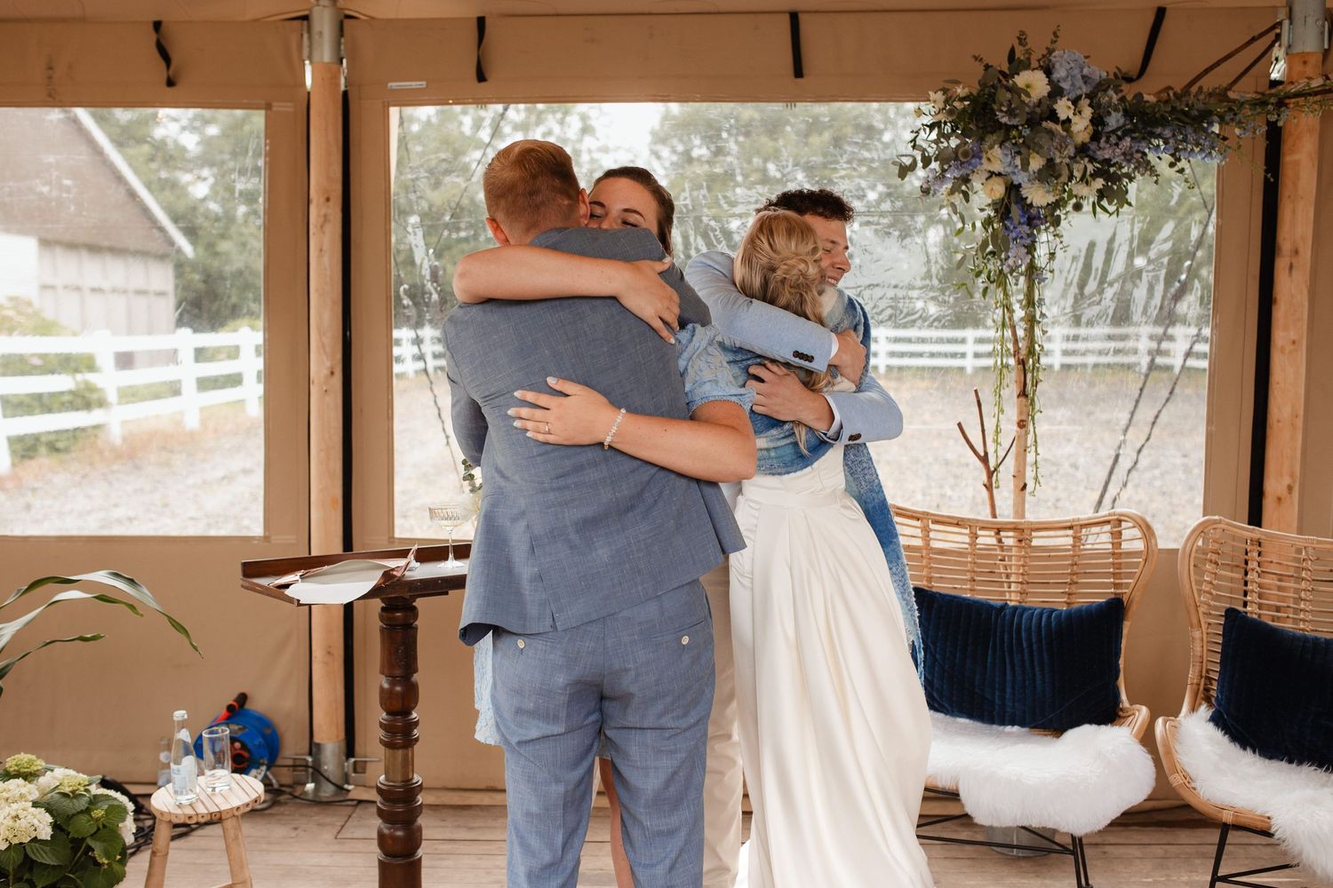Wedding celebration in a rustic barn venue with natural lighting.