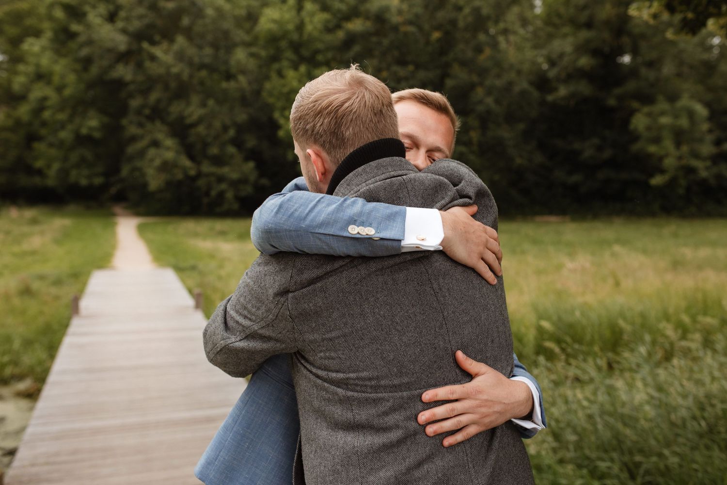 Natural outdoor wedding photography showing emotional embraces.