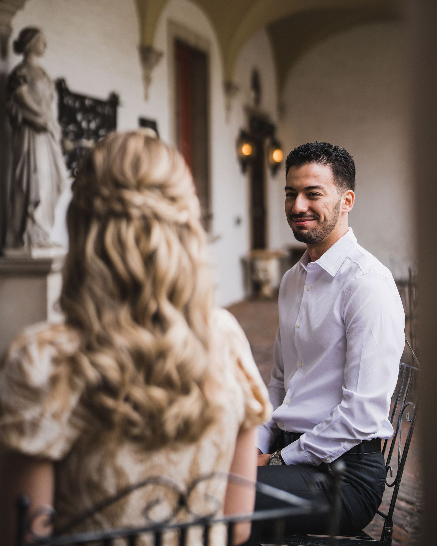 Interior photoshoot in elegant historic building with ornate architectural details.