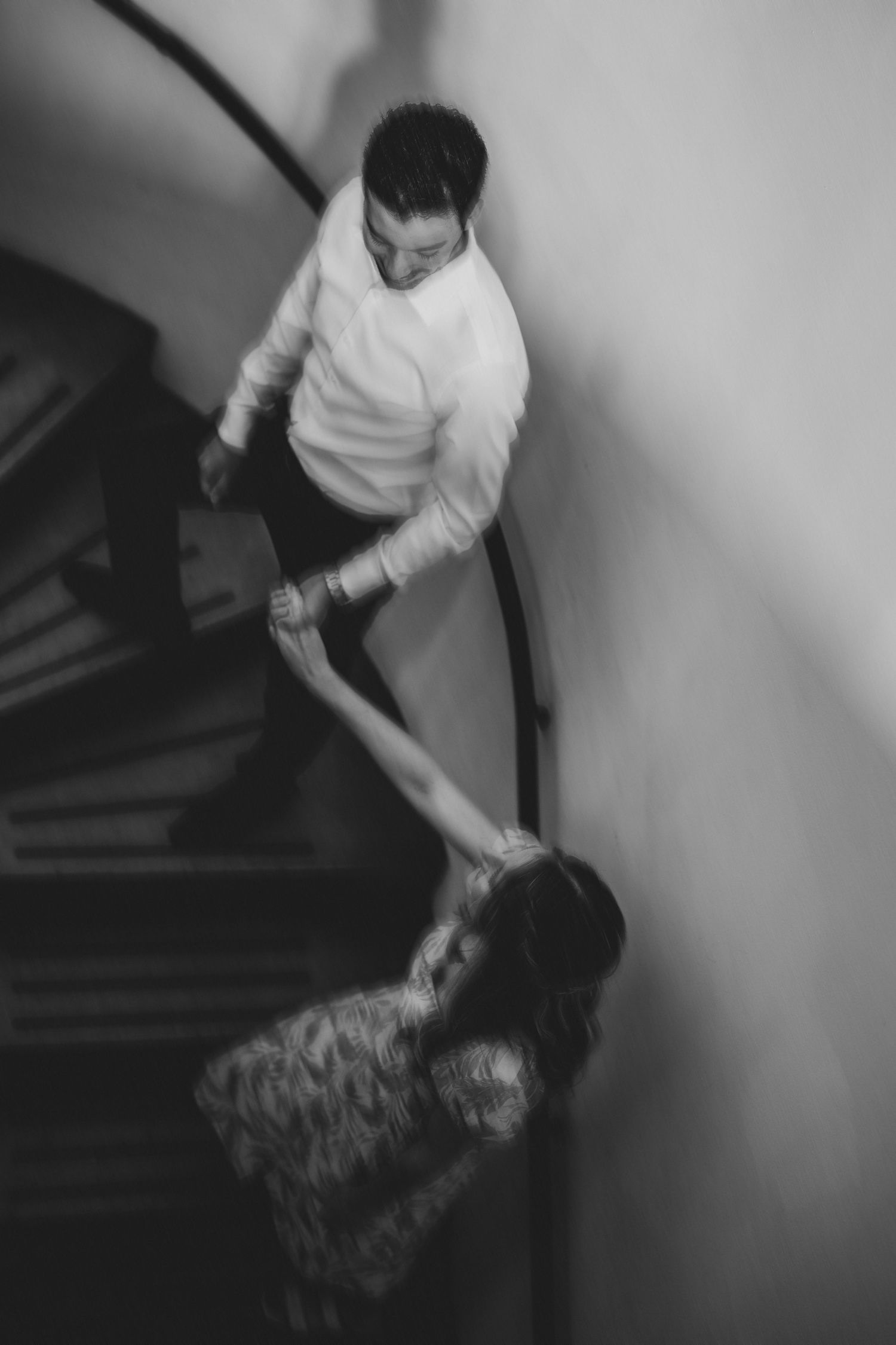 Artistic black and white sequence showing movement on a staircase.