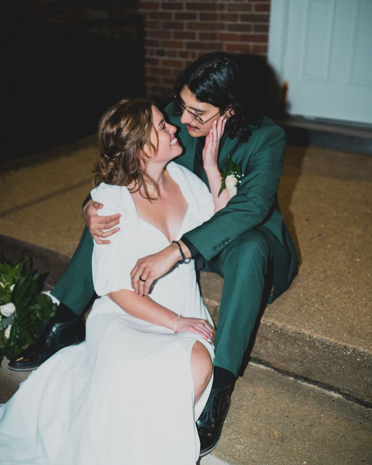 Intimate wedding moment captured in sequence against architectural backdrop.