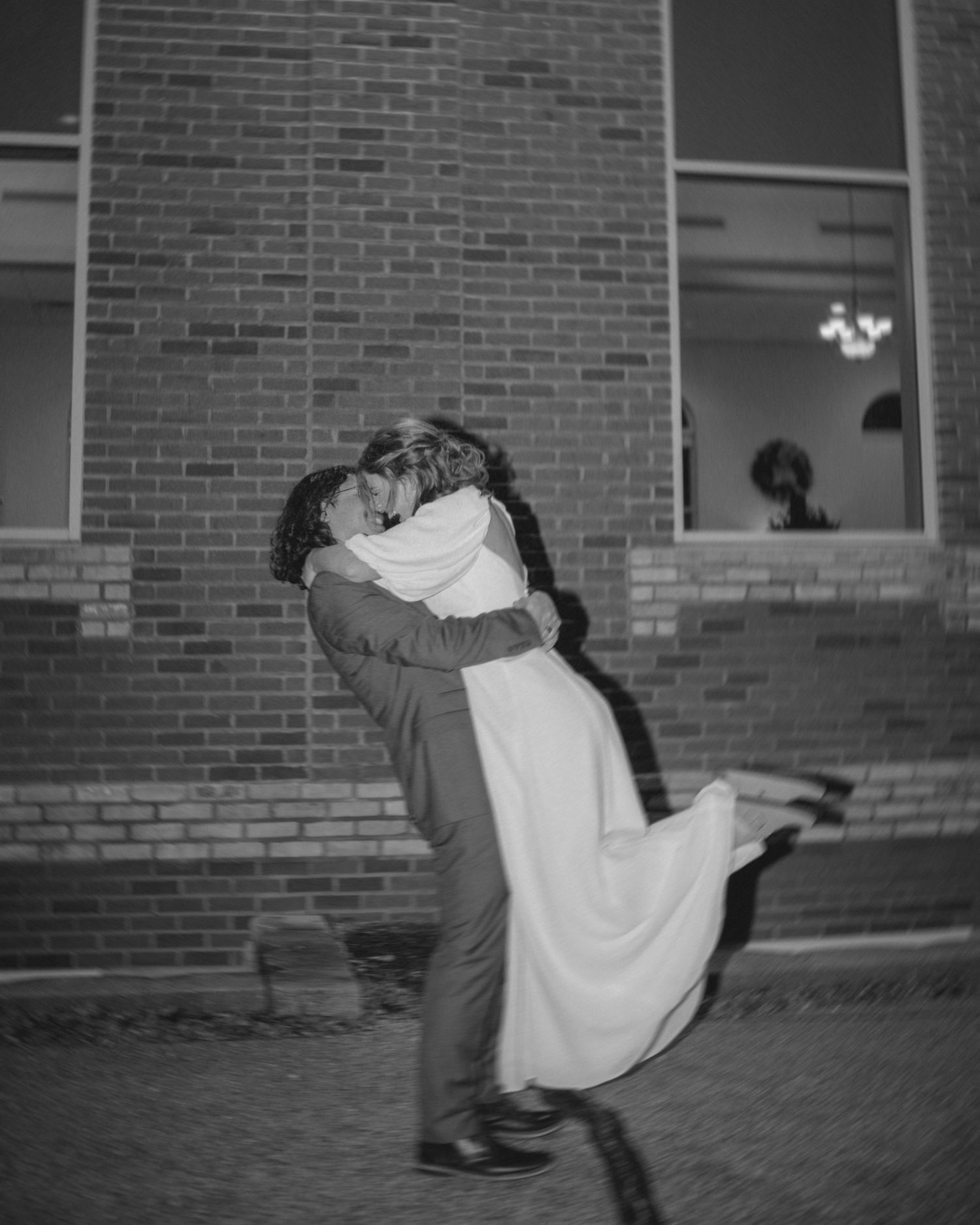 Black and white photos capture a series of romantic wedding dip kisses.