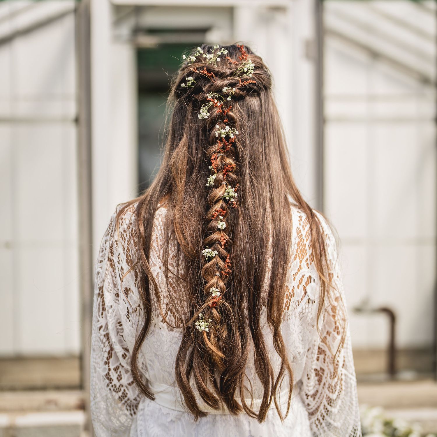 Detailed view of an intricate floral hair accessory with delicate blooms.