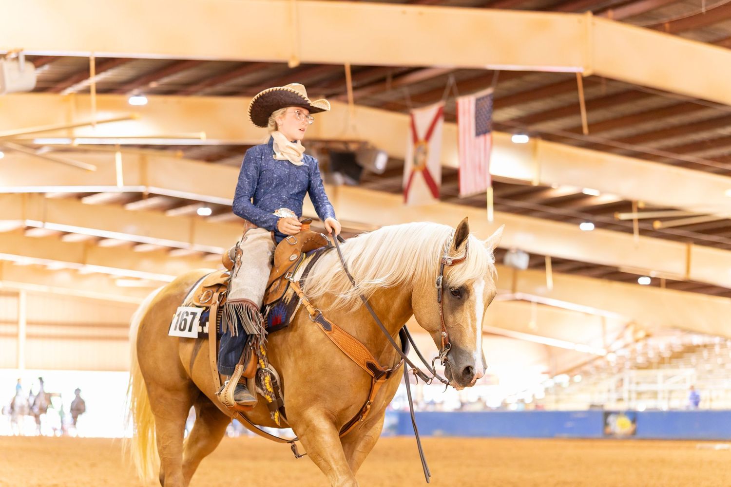 Youth rider showing palomino quarter horse in the ranch riding class at the 2026 AJ's Ranch Extravaganza.
