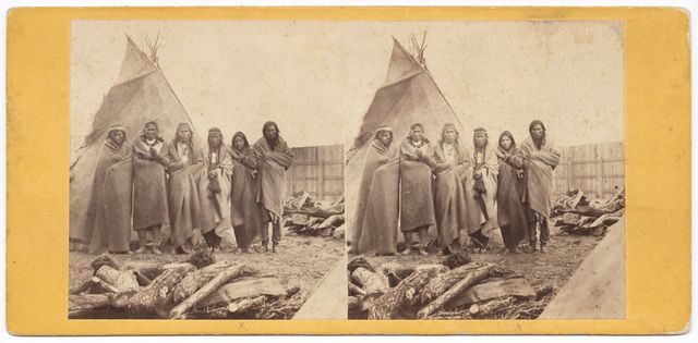 Six Dakota men in prison compound at Fort Snelling in 1862-63. From left, Otadan (Plenty), White Spider, Nispipe, Cloud Hoop, Wowinapee (son of Little Crow), unidentified. They were all Prisoners of the U.S.-Dakota War of 1862.