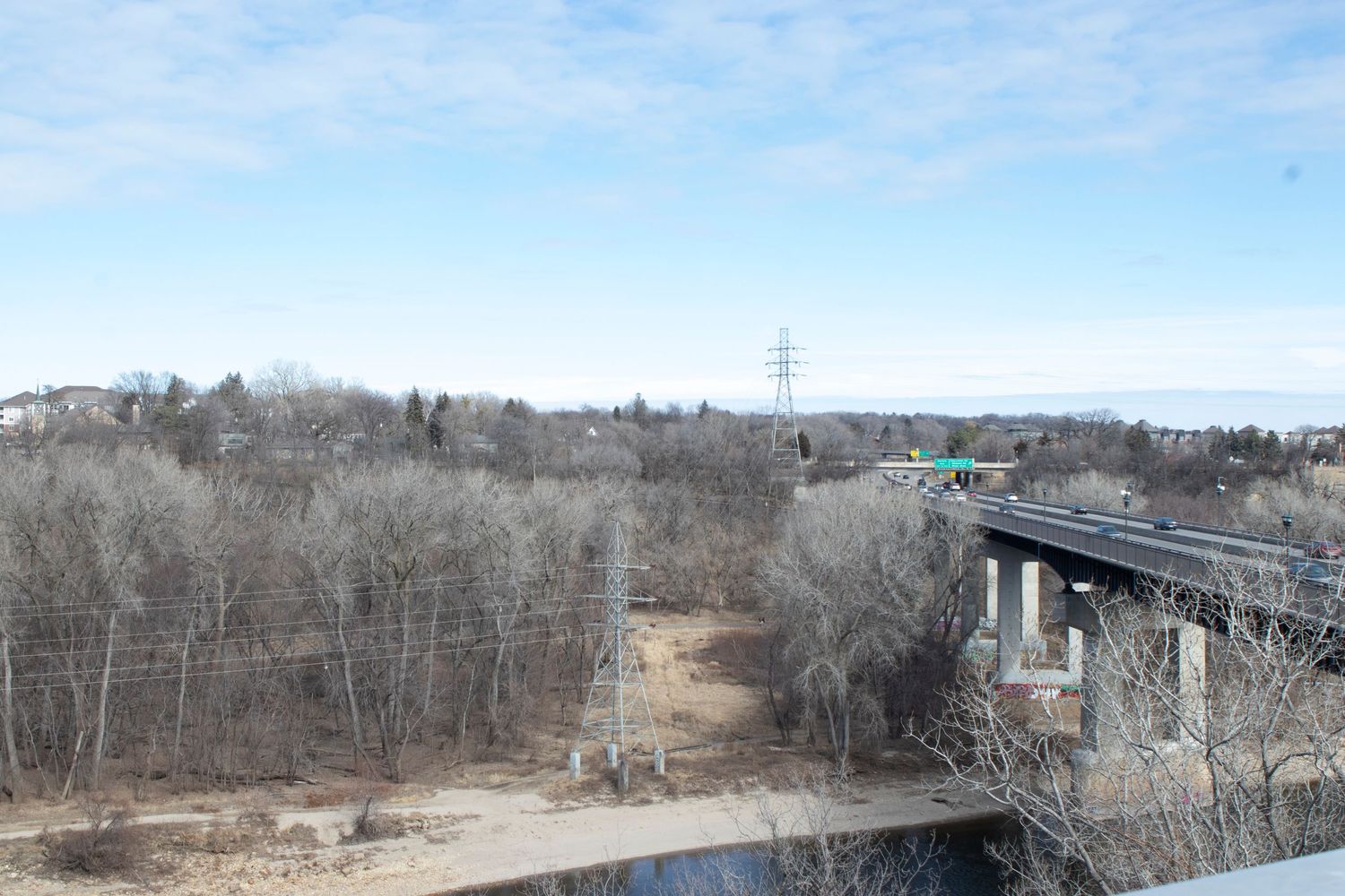 A year after the photograph on the left was taken, most of the remaining Da- kota were removed from their Minnesota homeland and brought to the Crow Creek reservation in South Dakota. Now, over the river where this photograph was made lies a highway, and the site of the violence is buried under the bluffs of Fort Snelling, but not forgotten.