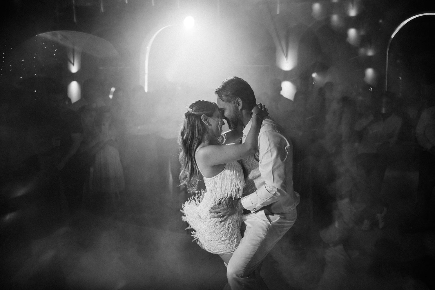 Black and white romantic dance scene with soft lighting and intimate atmosphere.