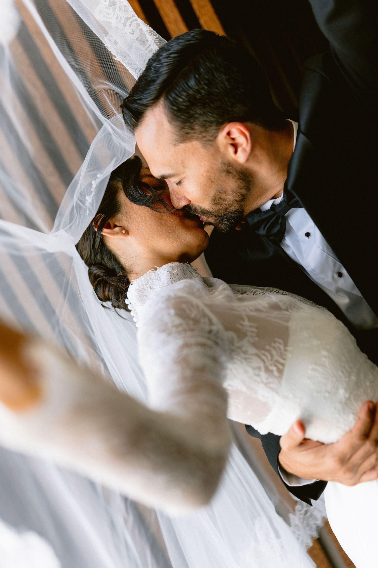 Intimate black and white wedding portraits showing tender moments between newlyweds.