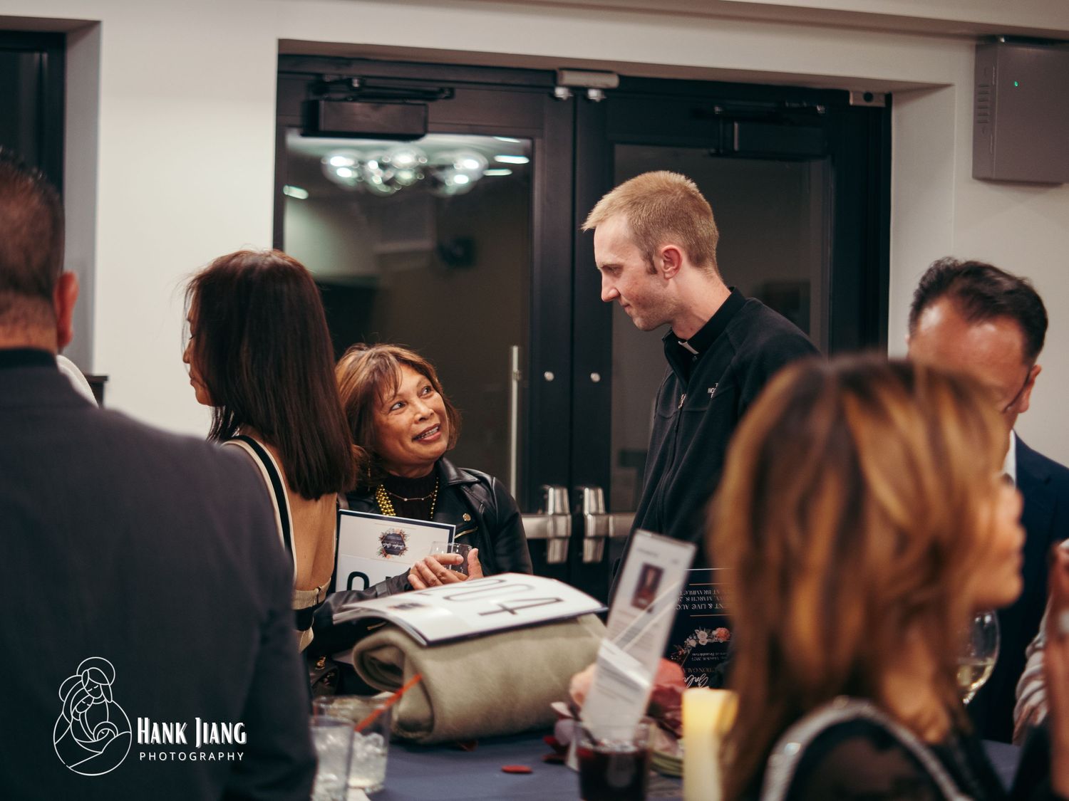 Guests networking at an elegant indoor event, captured by Hank Jiang Photography.