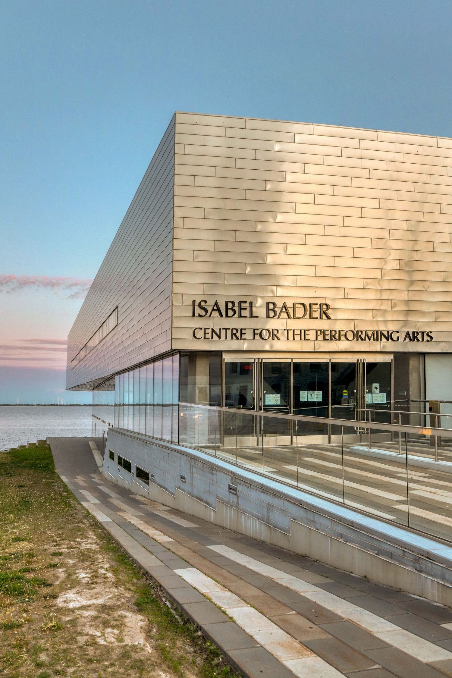 Modern architectural view of the Isabel Bader Centre for the Performing Arts building at sunset.