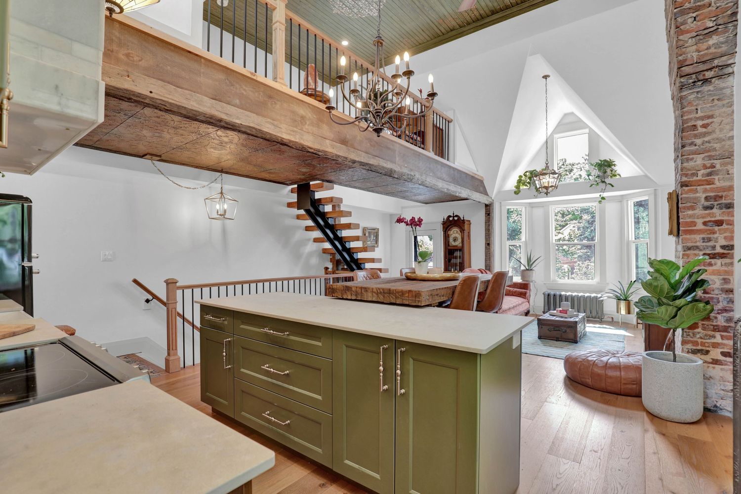 Rustic modern living space with exposed brick walls and wooden beam ceiling.