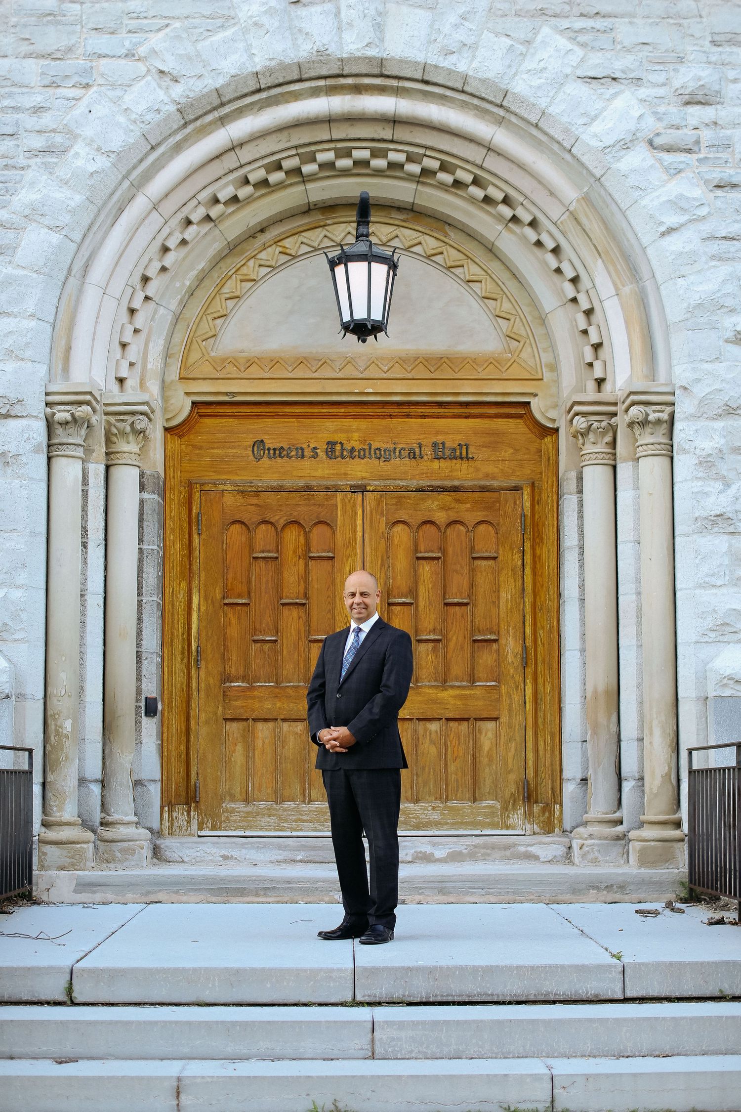 Architectural shots of ornate wooden doors at historic building entrance with stone archways.