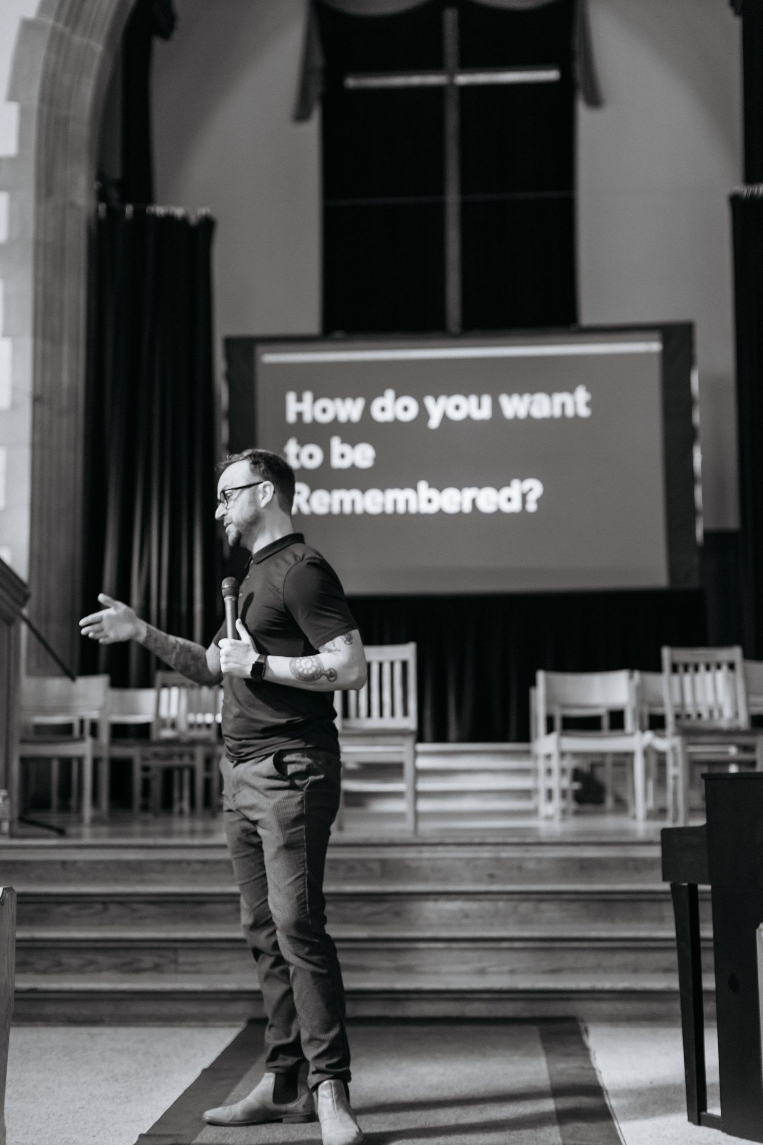 Black and white performance sequence with text display in church setting.