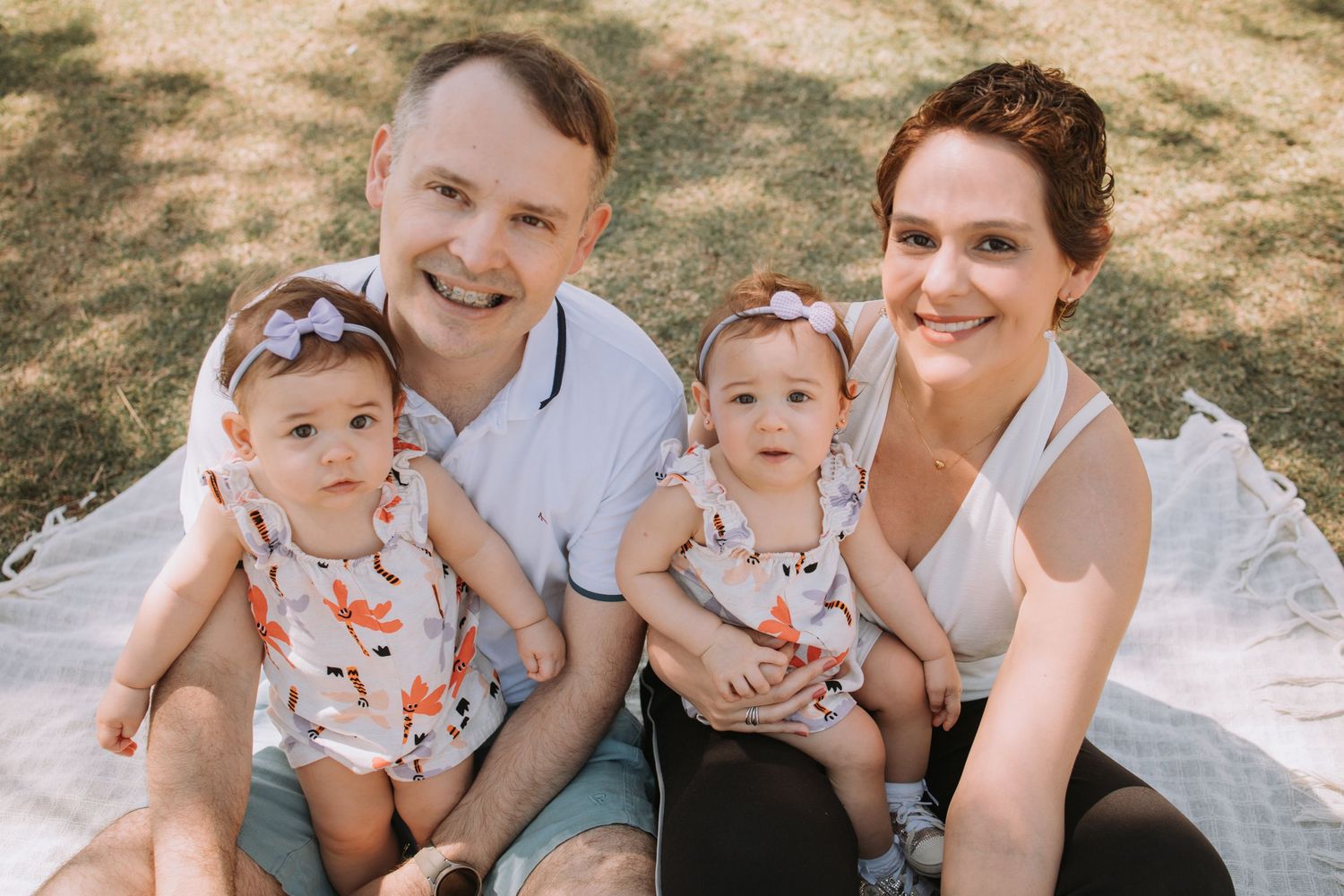 Candid family photos showing joyful interactions in a natural outdoor setting.