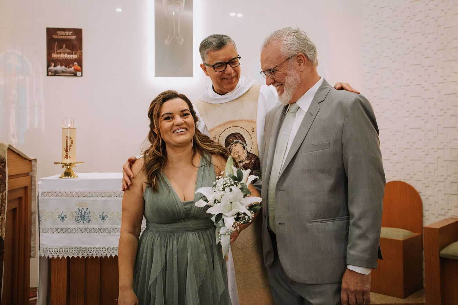 A couple shares an intimate moment during their wedding ceremony in a rustic church setting.