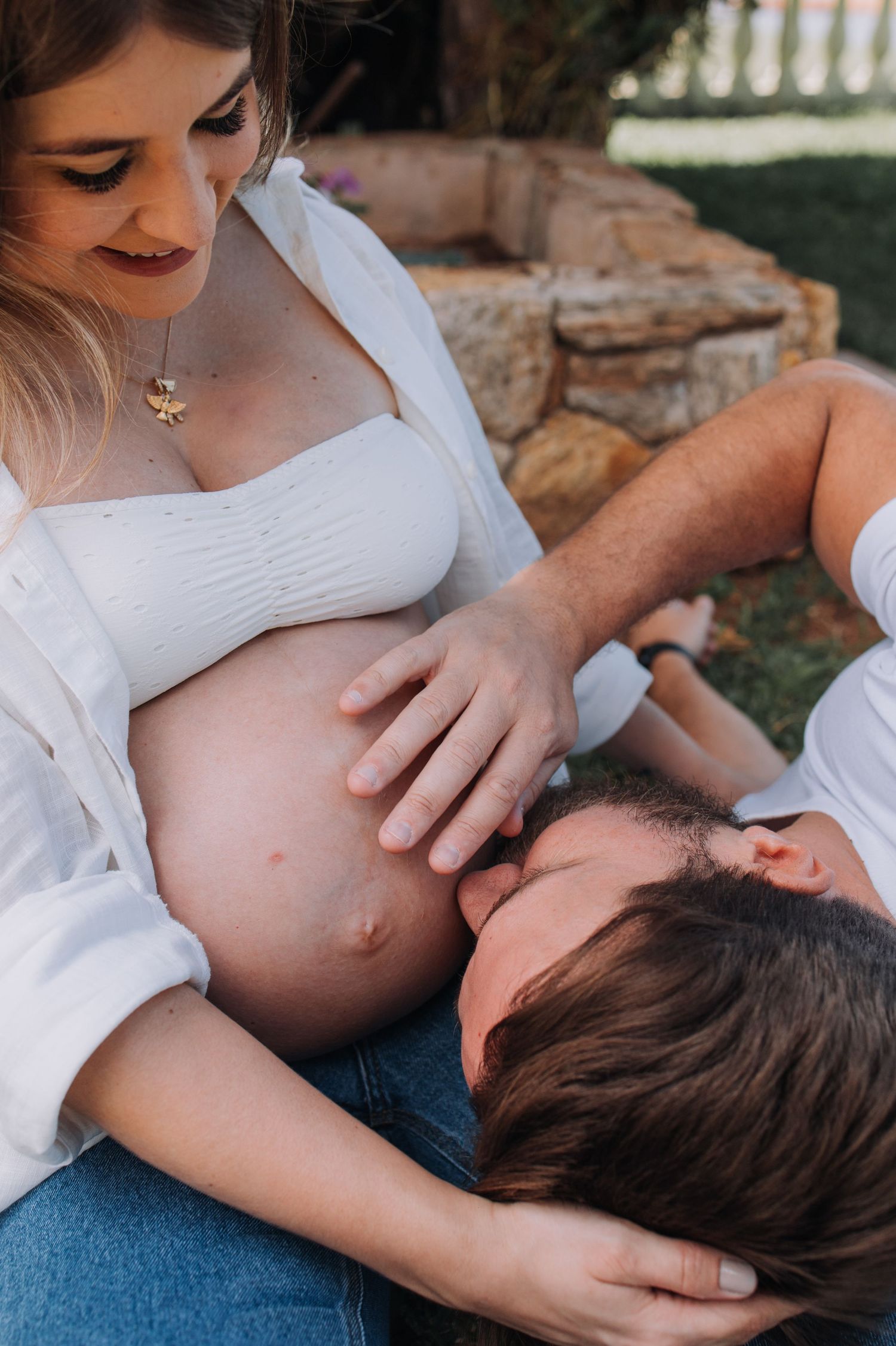 Intimate maternity photos showing gentle moments and tender touches.