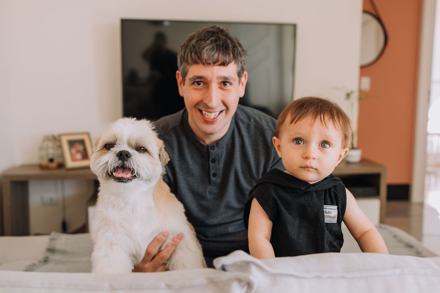 Family photos featuring a small white dog and casual indoor moments.